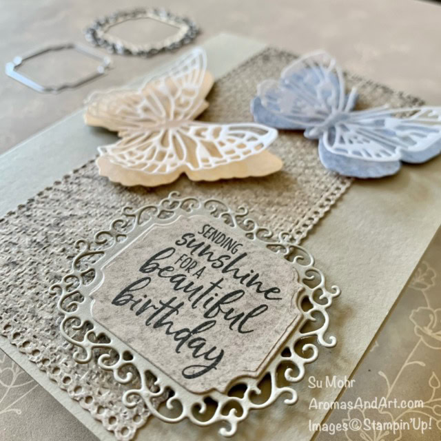 By Su Mohr for GDP285; Click aromasandart to go to my web site for details! Featuring: Brilliant Wings Dies, Ornate Layers Dies, Ornate Frames Dies, Sand & Sea Designer Paper, Welcoming Window Stamp Set; #brilliantwings #butterflies #butterfliesoncards #birthdaycards #sand&sea #ornatelayers #ornateframes #welcomingwindow #handmadecards #handcrafted #diy #cardmaking #papercrafting #sumohr #aromasandart #tastefultextileembossing